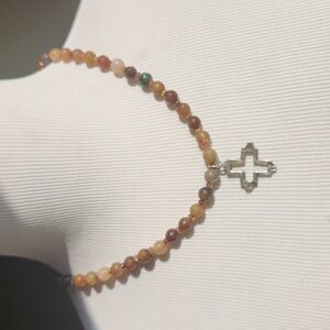 18" of tourmaline with a sterling silver cross